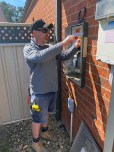 electrician installing switchboard